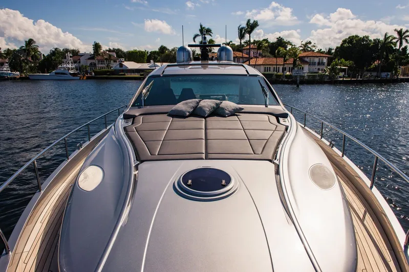 Argo Yacht Photos Pics Luxurious 2017 Pershing 70 yacht with sleek design, docked in a scenic waterfront setting.