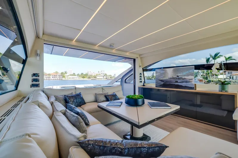 Argo Yacht Photos Pics Luxurious interior of 2017 Pershing 70 yacht with elegant seating and scenic views.