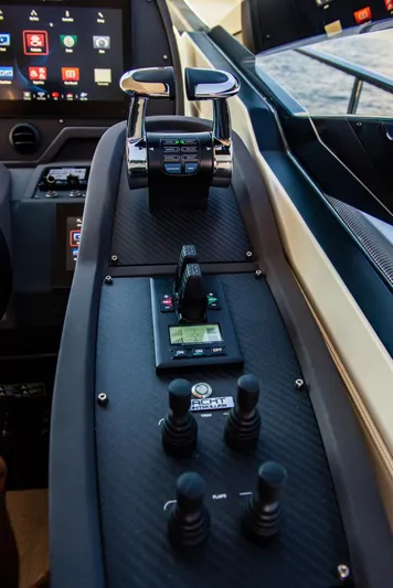 Argo Yacht Photos Pics Control panel of a 2017 Pershing 70 yacht, featuring advanced navigation technology.