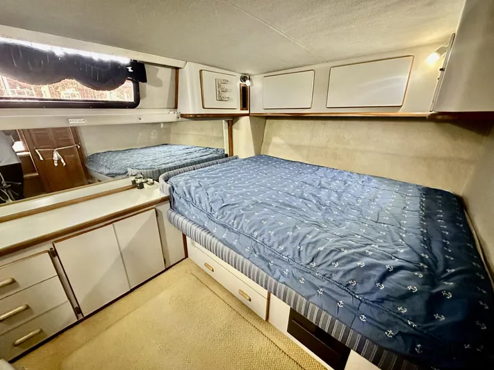 Tenacious Yacht Photos Pics 1990 Sea Ray 380 Aft Cabin interior with bed and storage.