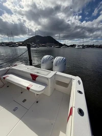 Wapala Yacht Photos Pics 2004 SeaVee 34 Center Console boat docked, featuring dual engines, with marina and mountain backdrop.