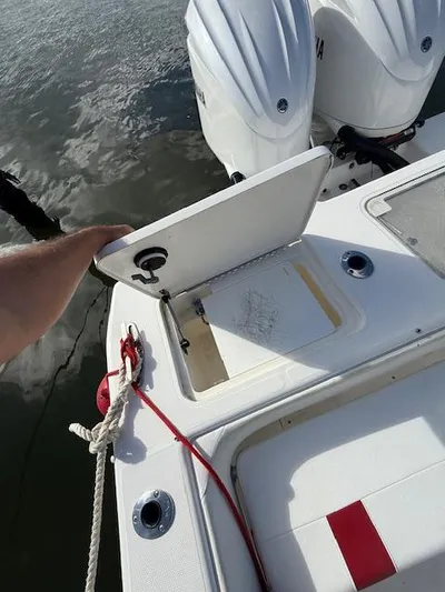 Wapala Yacht Photos Pics 2004 SeaVee 34 Center Console boat with open storage compartment and twin engines.