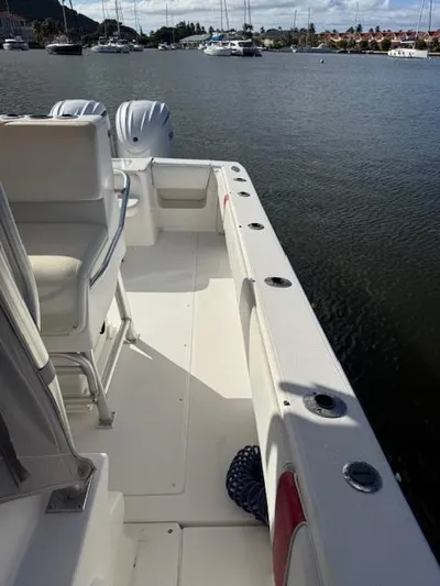 Wapala Yacht Photos Pics 2004 SeaVee 34 Center Console boat docked, featuring spacious deck and dual outboard engines.