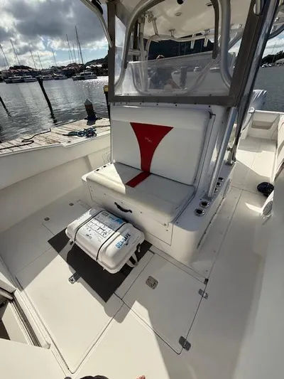 Wapala Yacht Photos Pics 2004 SeaVee 34 Center Console boat interior with seating and dock view.