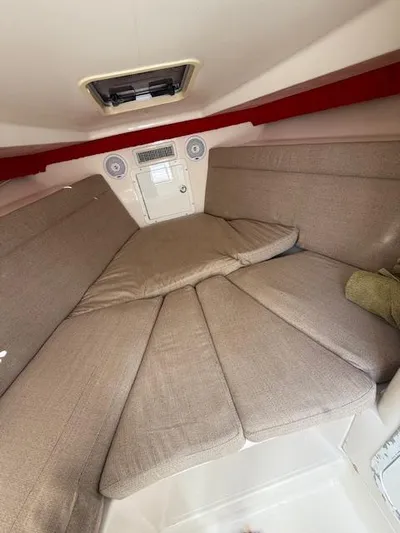 Wapala Yacht Photos Pics 2004 SeaVee 34 Center Console cabin interior with beige cushions and overhead hatch.