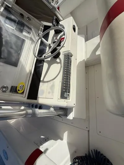 Wapala Yacht Photos Pics 2004 SeaVee 34 Center Console boat interior with steering wheel and control panel.