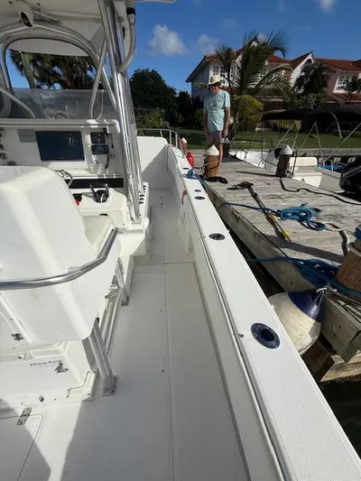 Wapala Yacht Photos Pics 2004 SeaVee 34 Center Console boat docked, featuring spacious deck and modern controls.