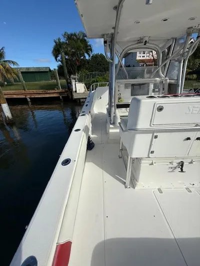 Wapala Yacht Photos Pics 2004 SeaVee 34 Center Console boat docked, showcasing spacious deck and seating area.