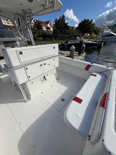 Wapala Yacht Photos Pics 2004 SeaVee 34 Center Console boat with spacious deck and seating, docked by the water.