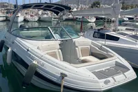 2016 Crownline Eclipse E2 XS boat docked in a marina, surrounded by other vessels.