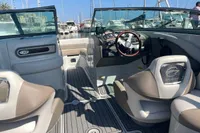 2016 Crownline Eclipse E2 XS boat interior with steering wheel and seating at marina.