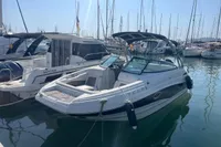 2016 Crownline Eclipse E2 XS boat docked in a marina, surrounded by other vessels.