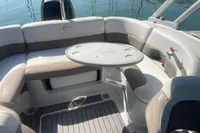 2016 Crownline Eclipse E2 XS boat interior with seating and table on calm water.