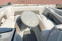 2016 Crownline Eclipse E2 XS boat interior with cushioned seating and table.