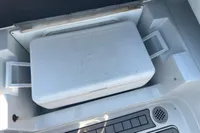 White Igloo cooler in a 2016 Crownline Eclipse E2 XS boat compartment.