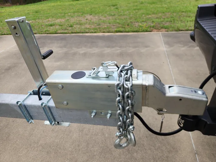  Yacht Photos Pics Trailer hitch with safety chains on a 2019 World Cat 296DC boat trailer.