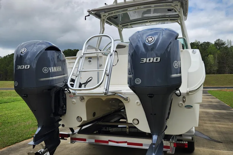  Yacht Photos Pics 2019 World Cat 296DC boat with dual Yamaha 300 engines, parked on a trailer.