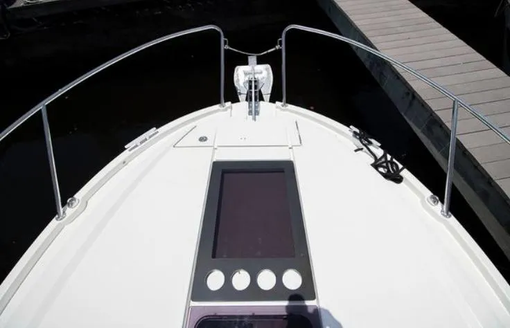  Yacht Photos Pics 2021 Beneteau Antares boat deck with railing and dock view.