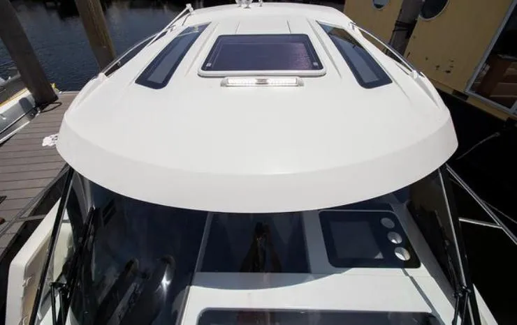  Yacht Photos Pics 2021 Beneteau Antares boat roof with skylight and sleek design.