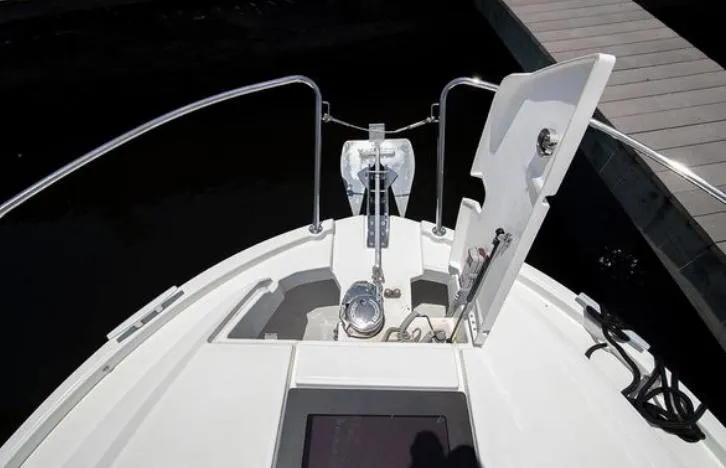  Yacht Photos Pics 2021 Beneteau Antares boat bow with anchor and open hatch at dock.