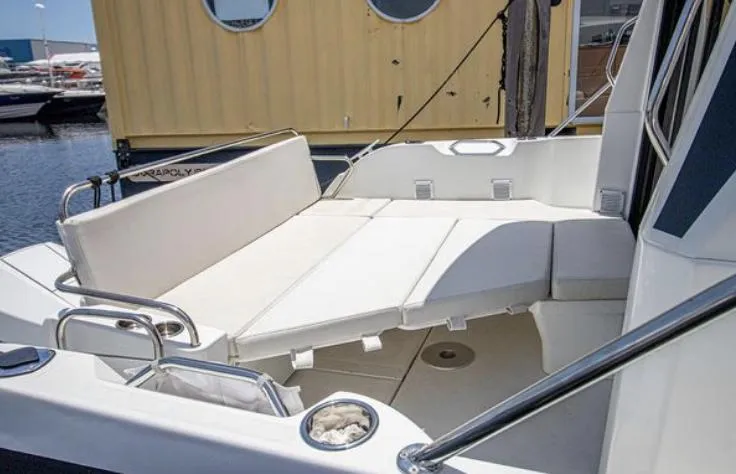  Yacht Photos Pics 2021 Beneteau Antares boat with spacious seating area and modern design.