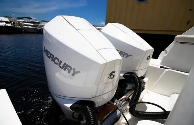  Yacht Photos Pics Twin Mercury outboard engines on a 2021 Beneteau Antares boat, docked at a marina.