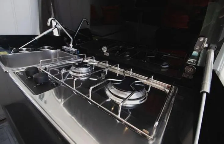  Yacht Photos Pics Modern kitchen in 2021 Beneteau Antares boat with stainless steel stove and sink.