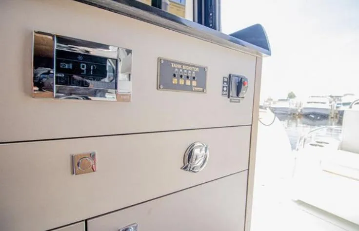  Yacht Photos Pics Control panel on 2021 Beneteau Antares boat, featuring tank monitor and digital display.