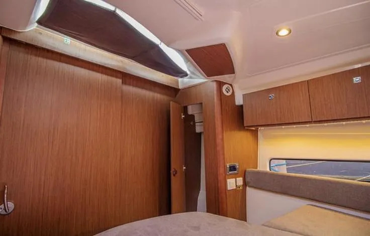  Yacht Photos Pics Interior cabin of 2021 Beneteau Antares with wooden finish and modern lighting.