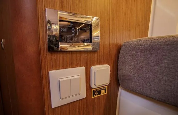  Yacht Photos Pics Control panel and switches inside a 2021 Beneteau Antares boat cabin.