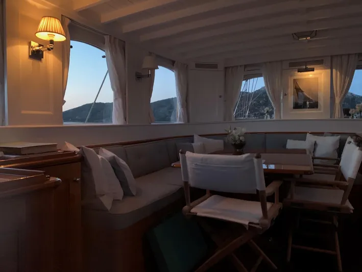 Iduna Yacht Photos Pics Interior of 1939 Feadship Classic Sailing Yacht with elegant seating and soft lighting.
