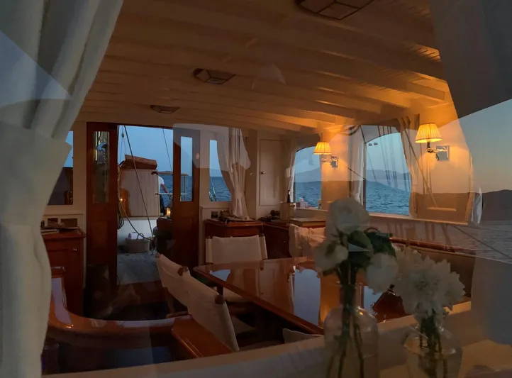 Iduna Yacht Photos Pics Luxurious 1939 Feadship Classic Sailing Yacht interior with elegant dining area and ocean view.