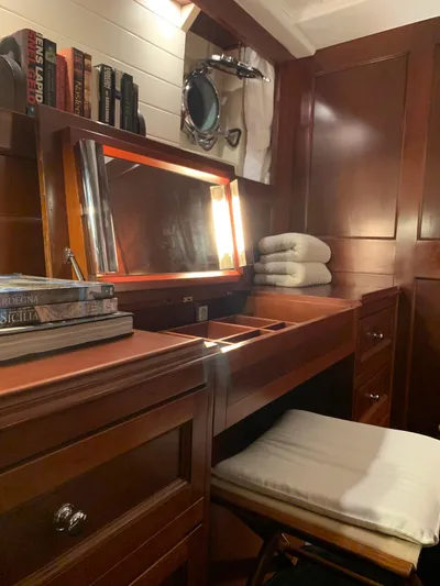 Iduna Yacht Photos Pics Classic 1939 Feadship sailing yacht interior with wooden vanity and nautical decor.