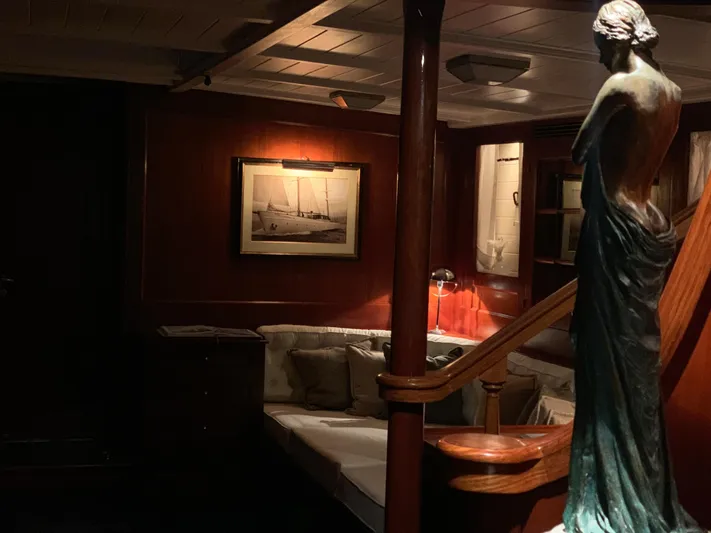 Iduna Yacht Photos Pics Classic 1939 Feadship yacht interior with elegant statue and vintage decor.