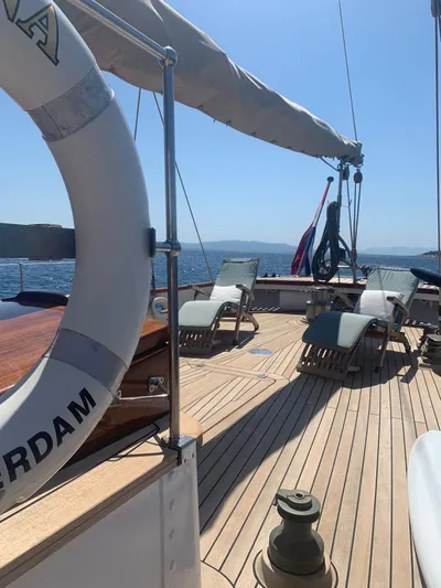 Iduna Yacht Photos Pics Classic 1939 Feadship sailing yacht deck with sun loungers and ocean view.