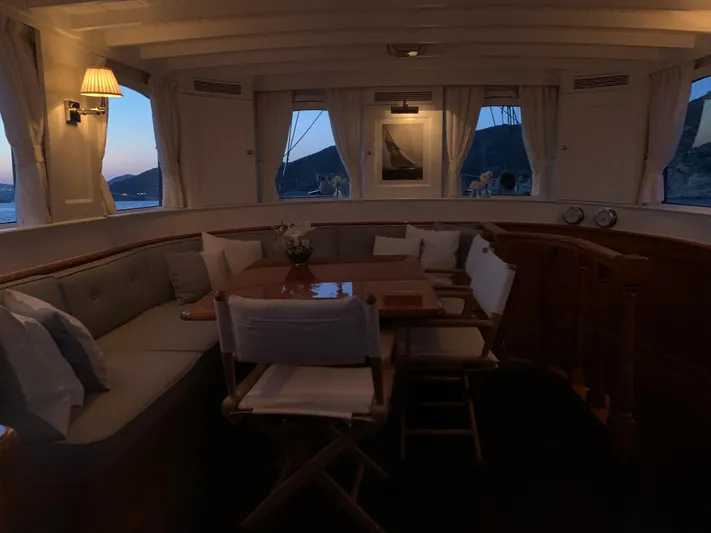 Iduna Yacht Photos Pics Classic 1939 Feadship sailing yacht interior with elegant seating and scenic window views.