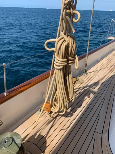 Iduna Yacht Photos Pics Classic 1939 Feadship sailing yacht deck with coiled ropes and ocean view.