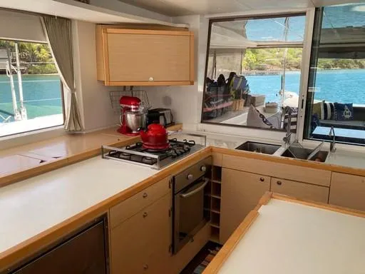 Recipe Yacht Photos Pics Interior of 2011 Lagoon 560 yacht kitchen with modern appliances and scenic ocean view.