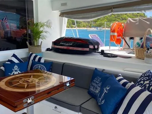 Recipe Yacht Photos Pics Luxurious Lagoon 560 yacht interior with nautical decor, cushions, and ocean view, 2011 model.