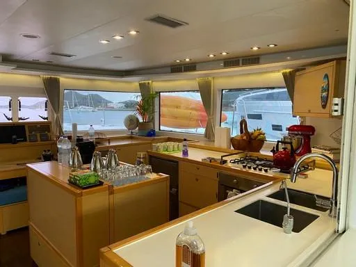 Recipe Yacht Photos Pics Luxurious interior of 2011 Lagoon 560 yacht with modern kitchen amenities and scenic window views.