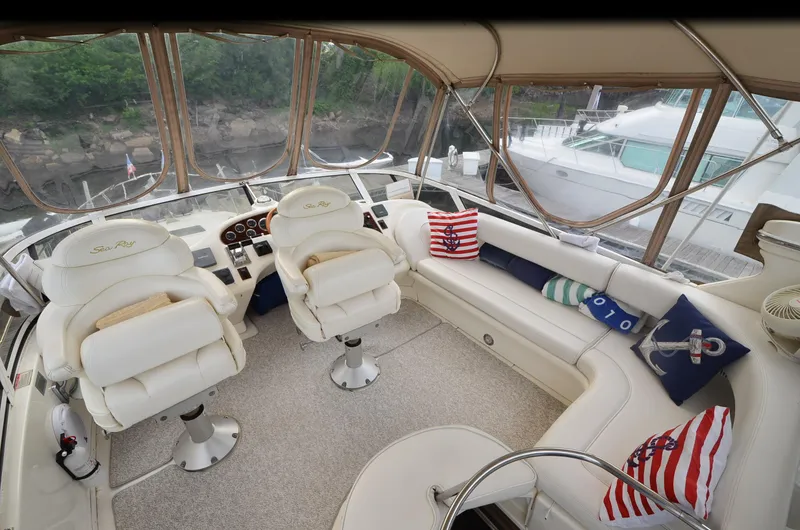 Escape Yacht Photos Pics Luxurious 2000 Sea Ray 420 Aft Cabin interior with plush seating and nautical-themed decor.