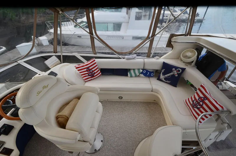 Escape Yacht Photos Pics Luxurious 2000 Sea Ray 420 Aft Cabin interior with nautical-themed cushions and plush seating.