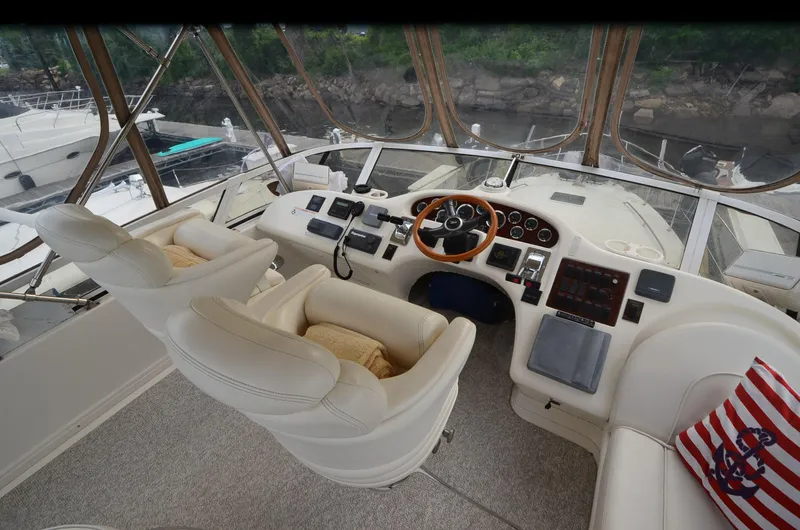 Escape Yacht Photos Pics Interior of 2000 Sea Ray 420 Aft Cabin yacht with helm and seating area.