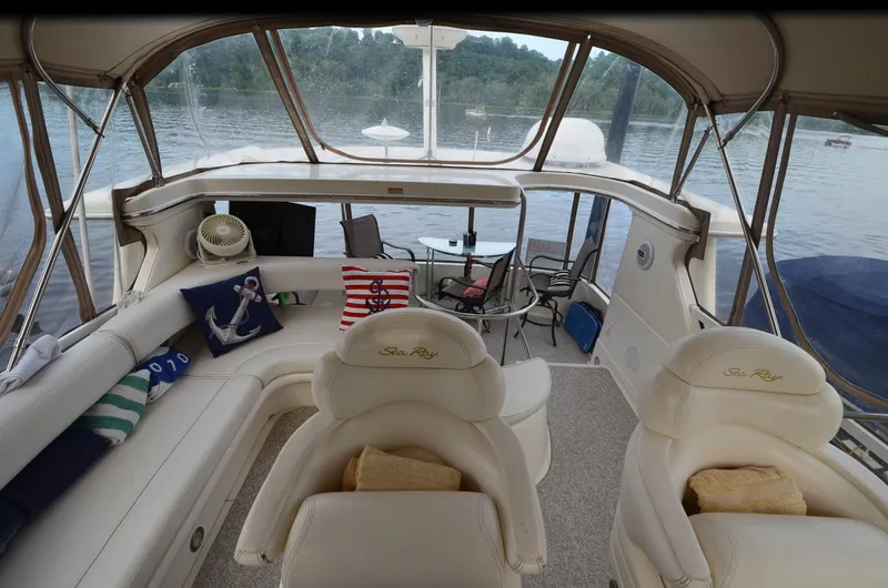 Escape Yacht Photos Pics Interior of 2000 Sea Ray 420 Aft Cabin yacht with comfortable seating and lake view.