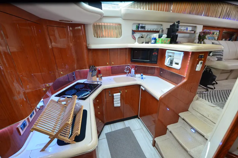 Escape Yacht Photos Pics Luxurious kitchen interior of 2000 Sea Ray 420 Aft Cabin yacht with modern amenities.