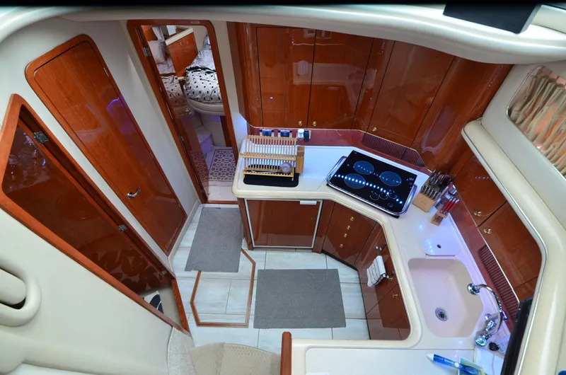 Escape Yacht Photos Pics Luxurious kitchen interior of 2000 Sea Ray 420 Aft Cabin yacht with modern amenities.
