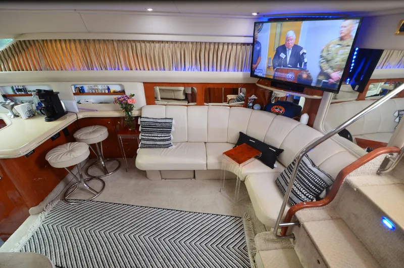 Escape Yacht Photos Pics Luxurious interior of 2000 Sea Ray 420 Aft Cabin yacht with plush seating and modern amenities.