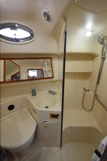 Escape Yacht Photos Pics Bathroom interior of 2000 Sea Ray 420 Aft Cabin yacht, featuring shower and sink.