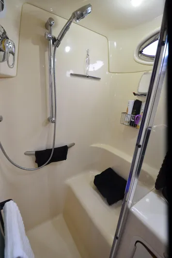 Escape Yacht Photos Pics Shower area in 2000 Sea Ray 420 Aft Cabin yacht, featuring modern fixtures and storage.