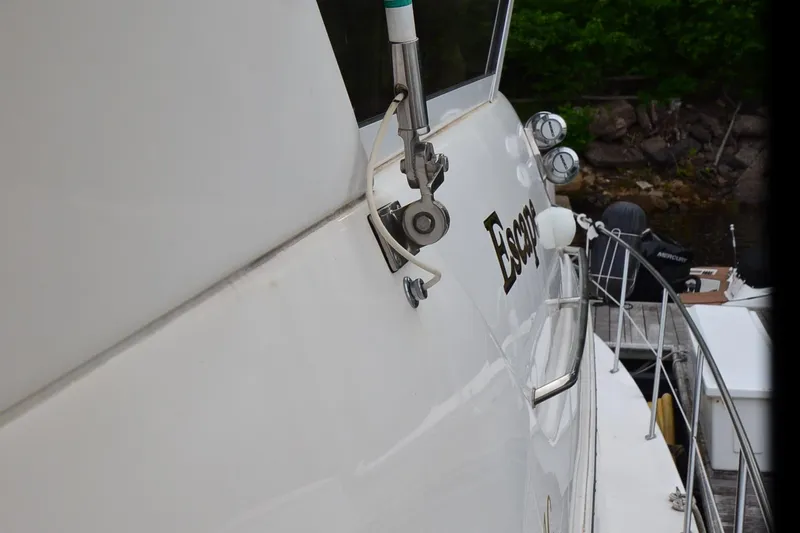 Escape Yacht Photos Pics 2000 Sea Ray 420 Aft Cabin yacht docked, showing side view and railing details.